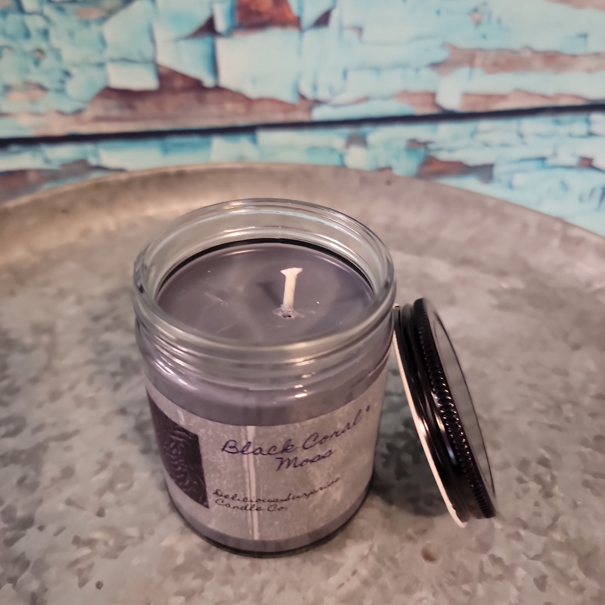 Black Coral & Moss Delicious Surprise Candle Co.